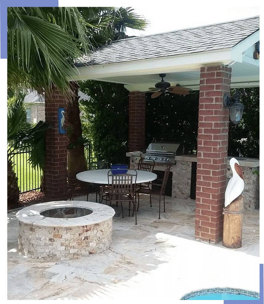 Covered outdoor kitchen with dining table