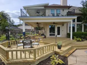 Spacious backyard deck with seating and ramp access.