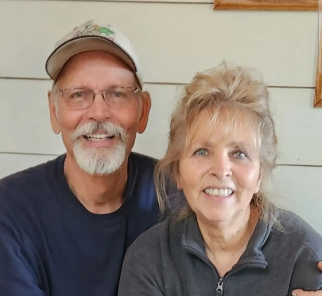 Smiling older couple posing together indoors